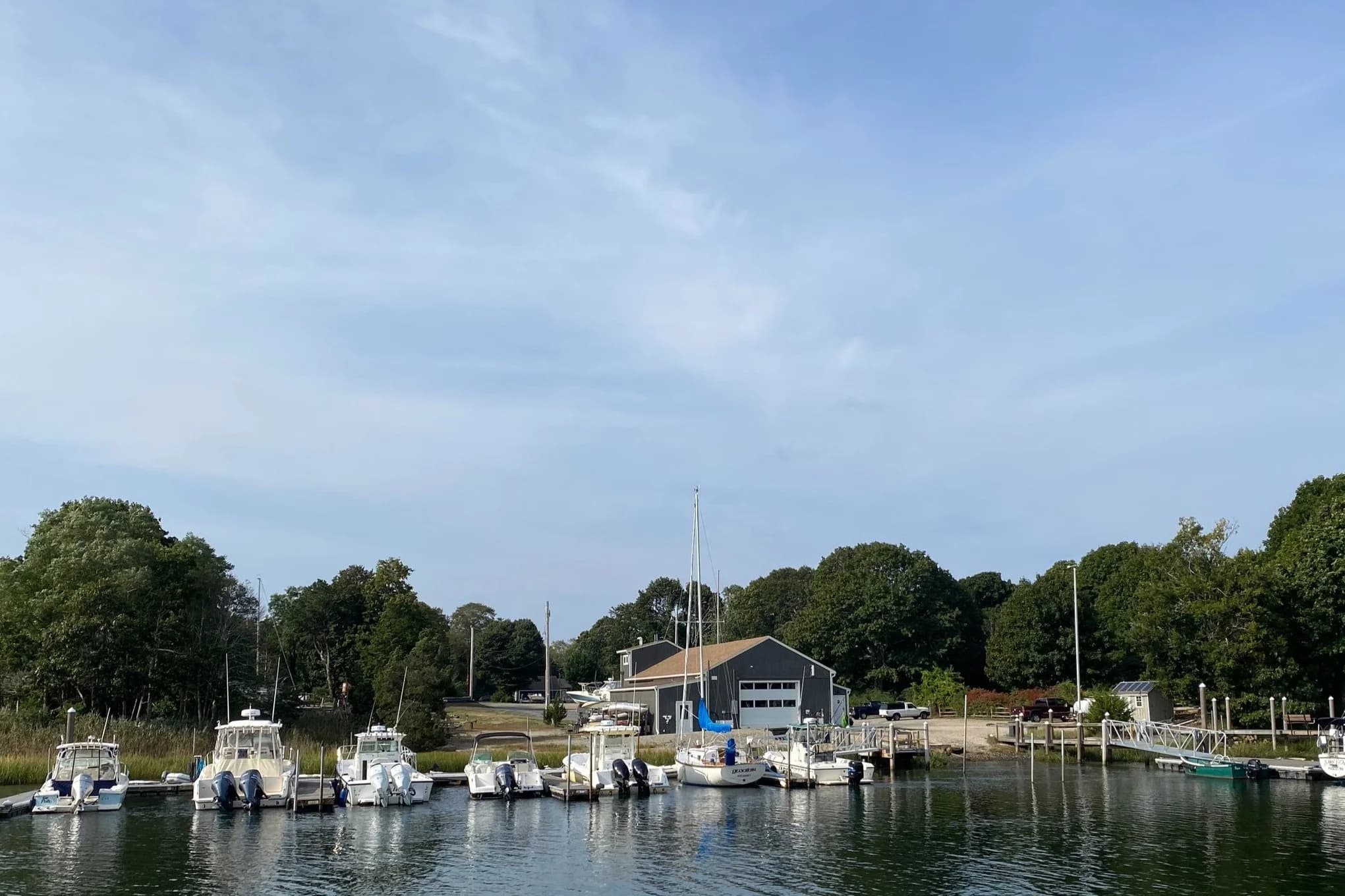 Scallop Bay Marina seen from the Pocasset River, with boats at the floating docks